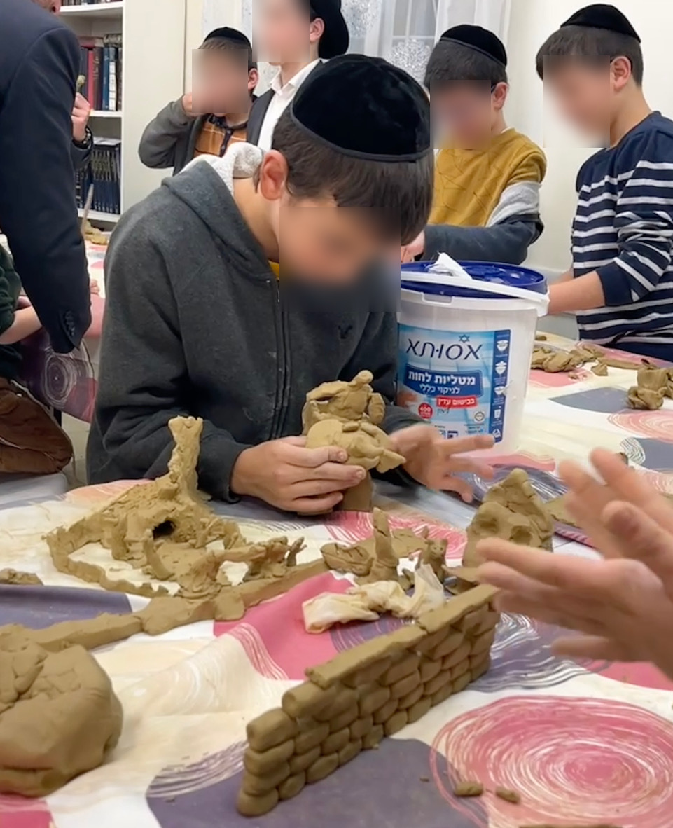 Kids shaping clay sculptures