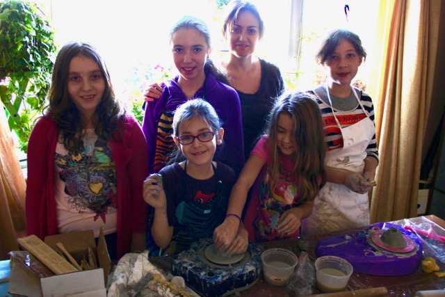 Students working with clay