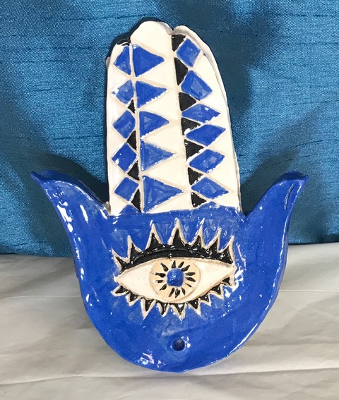 Blue hamsa with evil eye motif