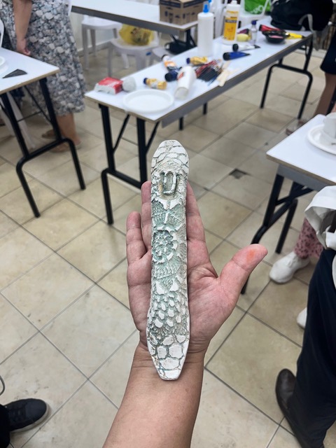 Textured mezuzah in hand