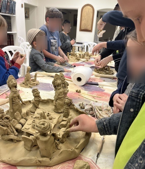 Kids working with clay in class