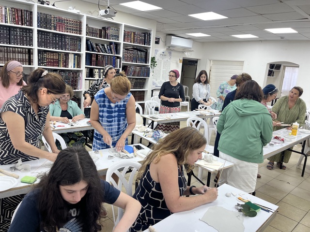 Ceramics class among the bookshelves