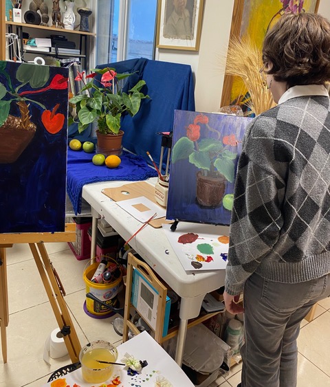 Children painting a still life