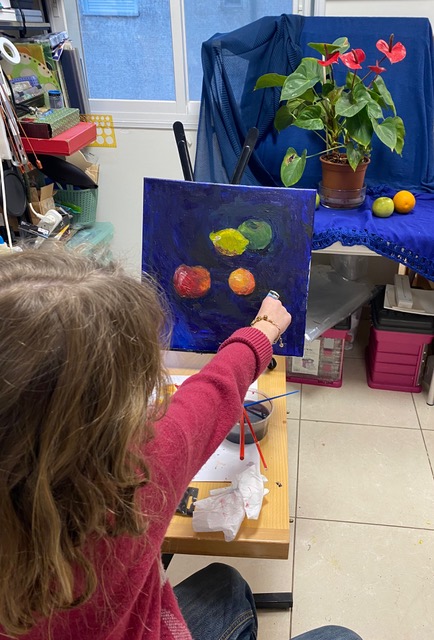 Child with a fruit still life