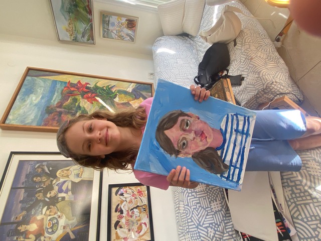 Students with their paintings