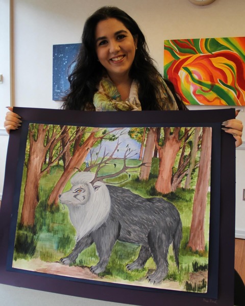 Student with painting of mythical beast
