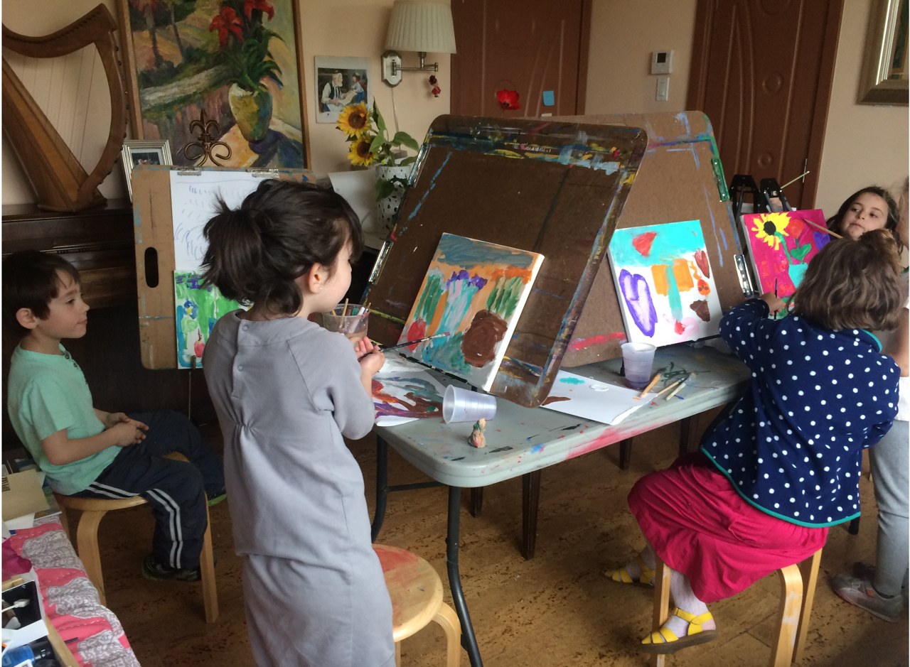 Children painting at easels