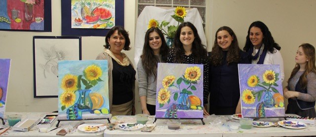 Student with a portrait painting