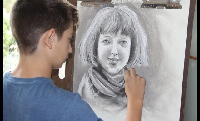 Student drawing a portrait