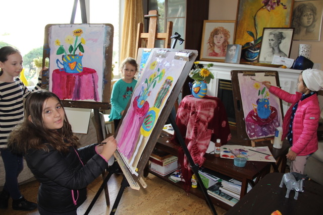 Children painting at easels