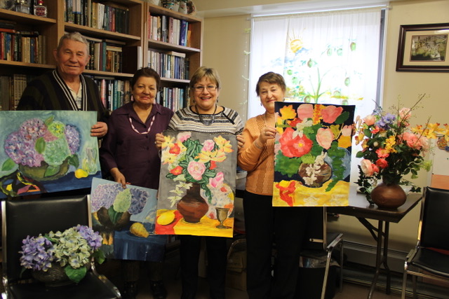 Students with their floral paintings