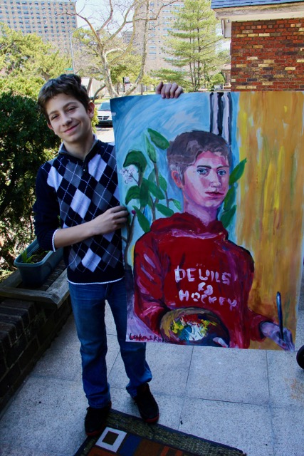 Student with self-portrait
